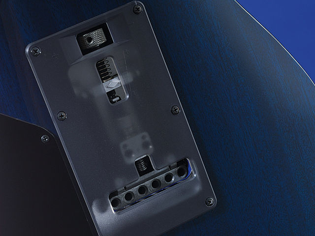 The SV5470 has a thumb screw to facilitate string tension adjustment without having to take the cover off the tremolo cavity